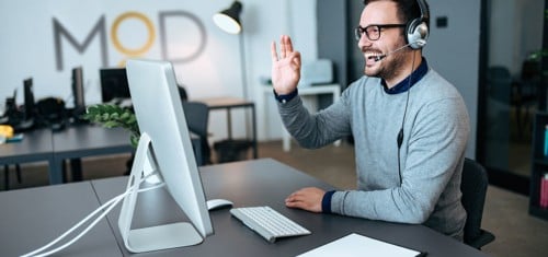 a happy myoutdesk virtual assistant on a video call