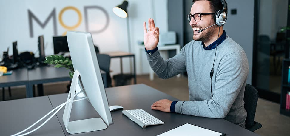 a happy myoutdesk virtual assistant on a video call