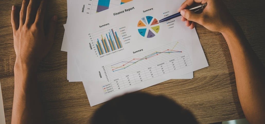 Person reviewing a graph of financials 