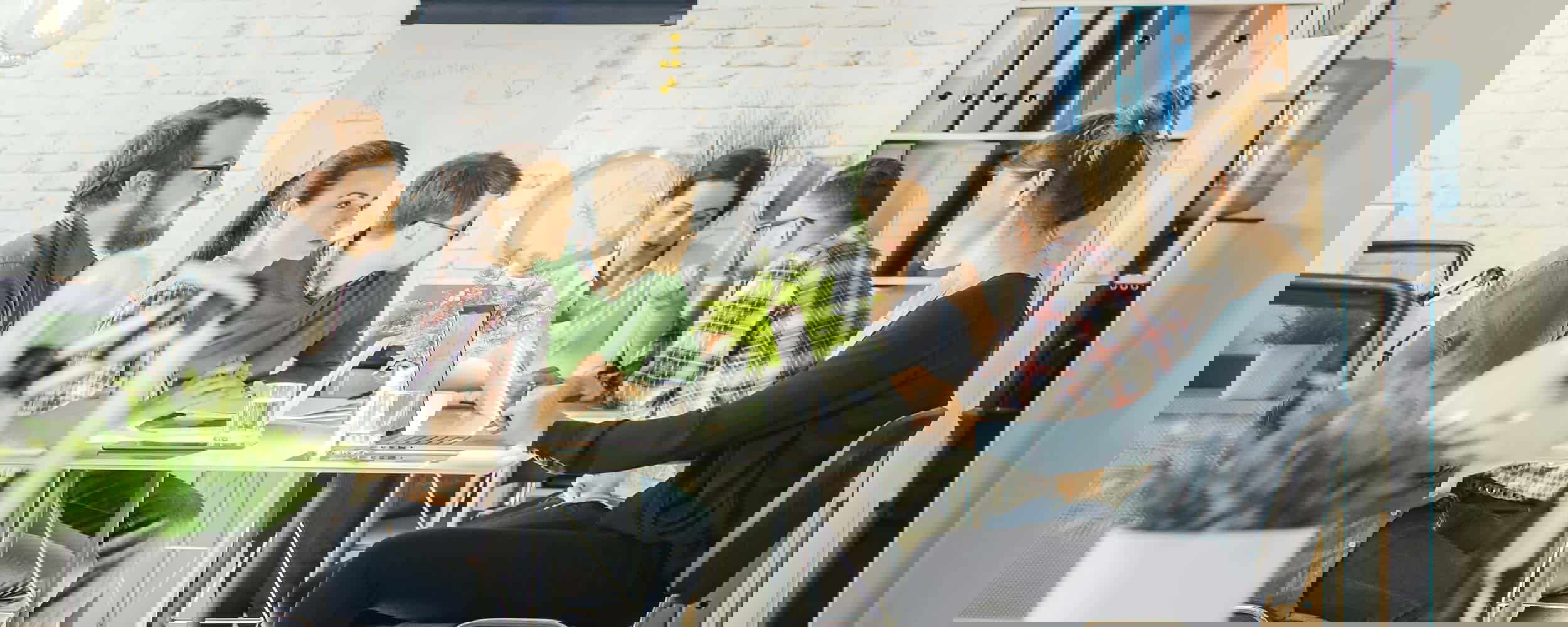 a team of marketers working together at a table