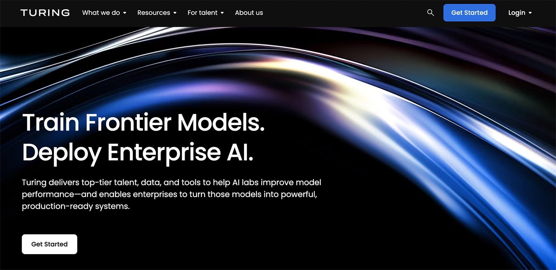 Homepage of Turing, featuring the text Train Frontier Models. Deploy Enterprise AI for solutions like healthcare virtual assistants, over an abstract, metallic wave background, with navigation links and a Get Started button visible at the top.